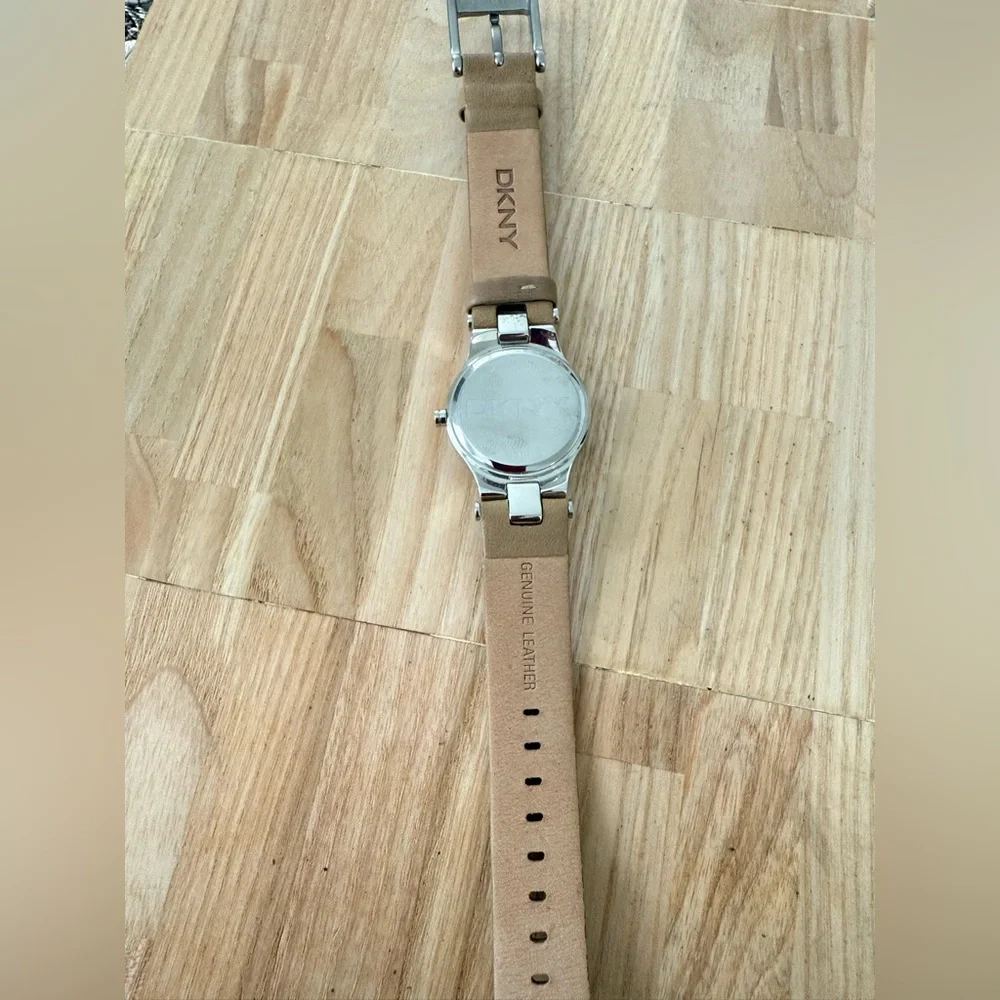 DKNY ladies silver tone tan leather dress watch NEW BATTERY